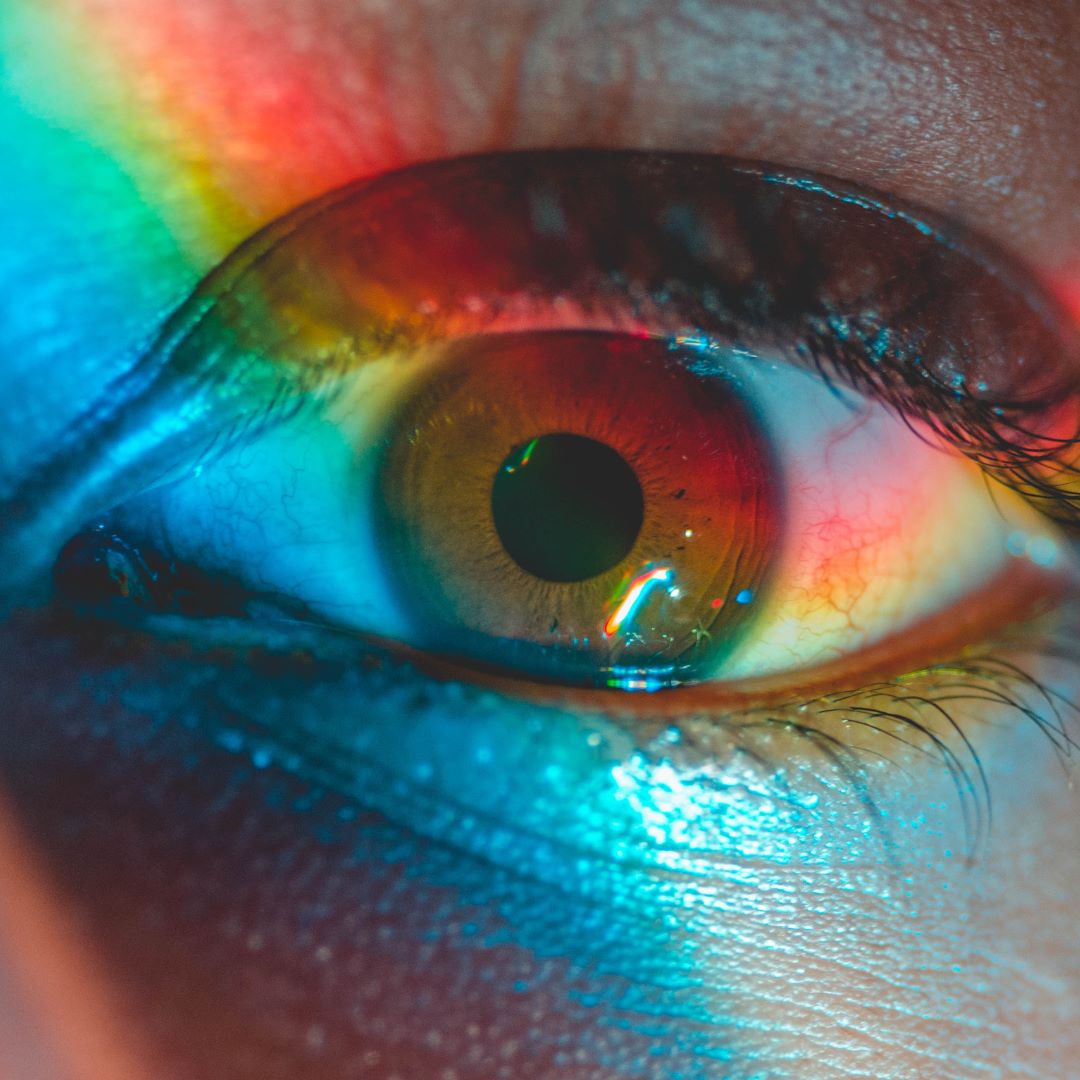 Image of eye with rainbow across it